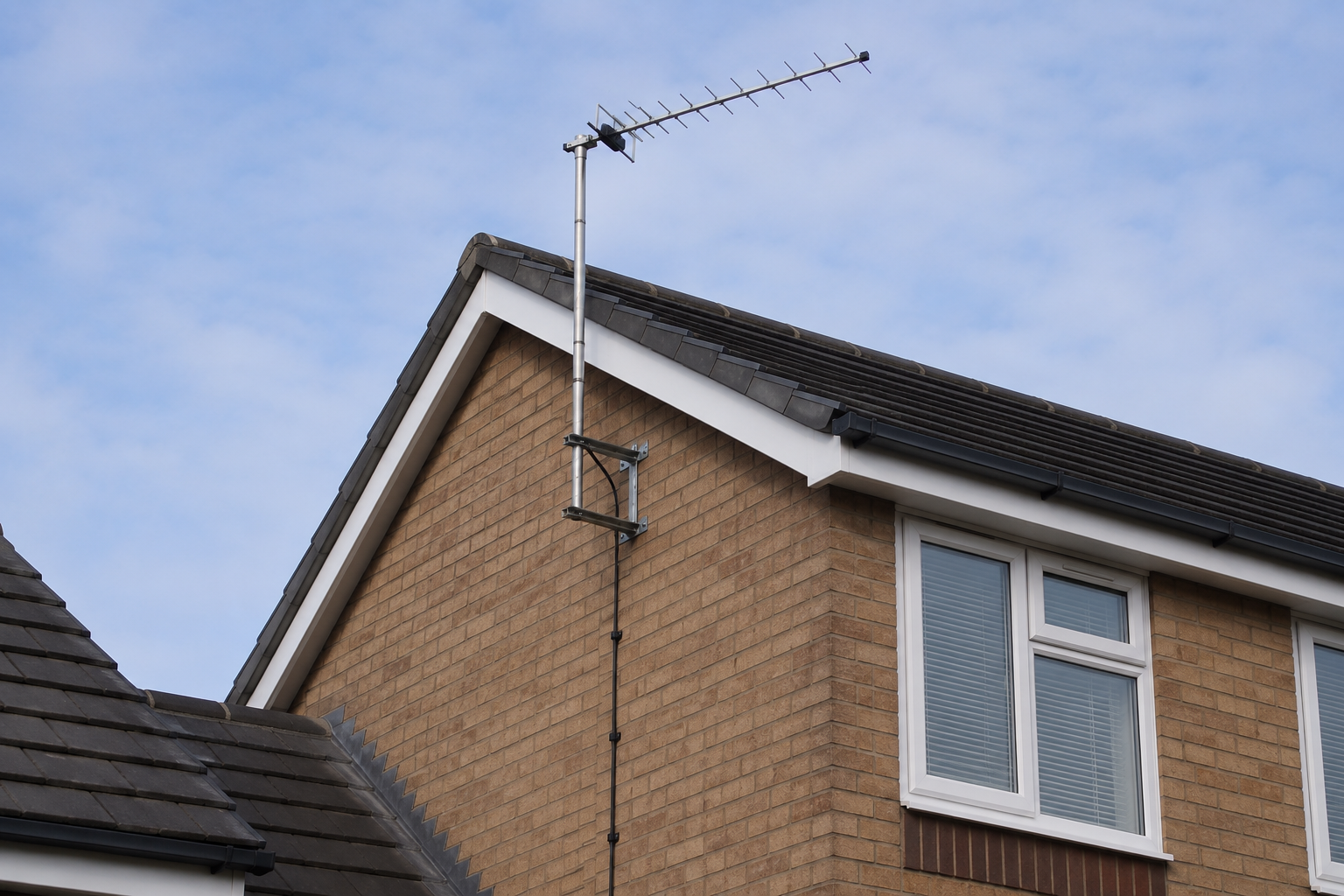 External TV aerial mounted on a house wall in Bedworth